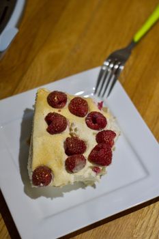 Delicious and fresh home made tiramisu with raspberry. Sweet food concept.