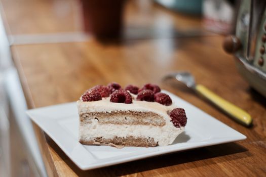 Delicious and fresh home made tiramisu with raspberry. Sweet food concept.