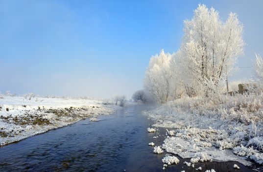 Winter river on a sunny day in Brasov, Romania