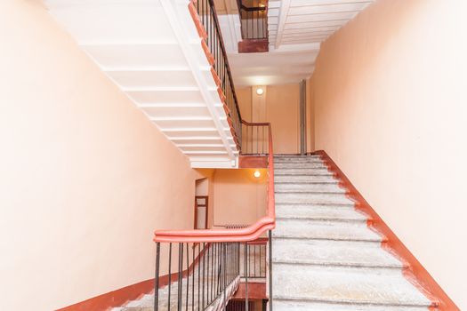 empty entrance in apartment building stairwell beige color