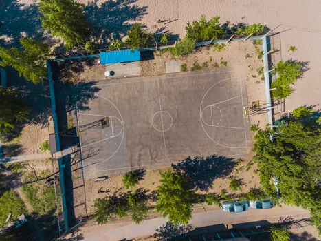 Aerial view basketball field on day time on the beach. Above with drone. Volleyball