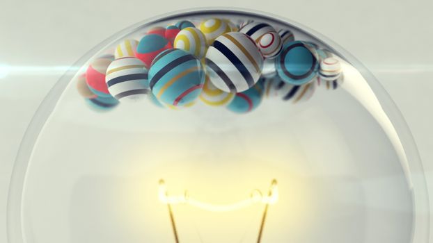 An original 3d illustration of a transparent glass ligh bulb with a a lit metallic wire and small striped and colorful balls in it. They are placed in the upper part of a lamp in the grey background