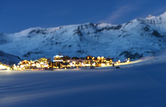 Fuzzy photographic effect : landscape and ski resort in French Alps at night with lights,Tignes, Tarentaise, France 