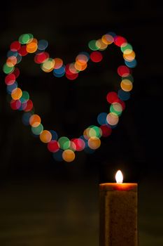 Candles light with bokeh like heart. Abstract candle background. 