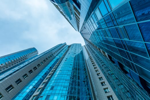 Modern building exterior low angle view with blue sky