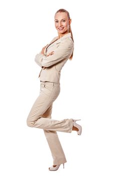 One Standing business woman wearing beige suit isolated on white