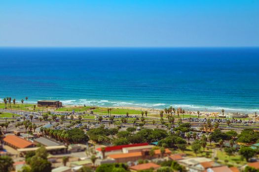 Aerial view of Tel Aviv promenade. Recognized places such as the Etzel Museum, Tel Aviv beach and Neve Tzedek neighborhood. Tilt shift.