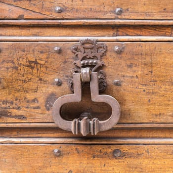 Close up of rustic old door in Spoleto, Italy.