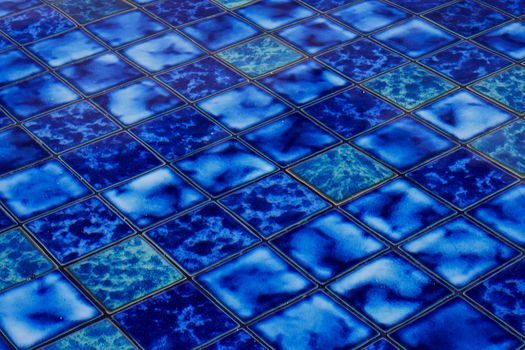 Blue ceramic mosaic in a pool on bali