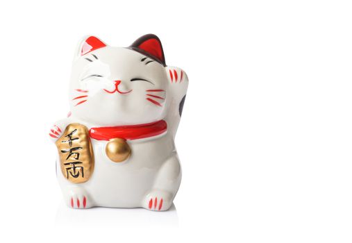 Maneki Neko ceramic japanese lucky cat isolated on white background