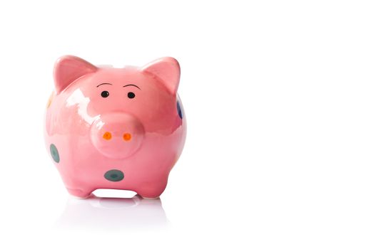 Pink ceramic piggy bank on white background, saving money concept