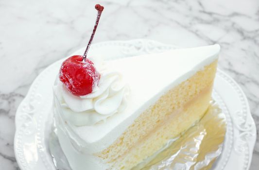 Closeup Milk cake with delicious on white marble table in coffee shop, sweet and dessert concept, selective focus