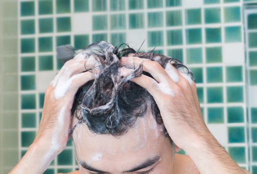 Closeup men washing hair and taking a shower in the bathroom, health care and medical concept