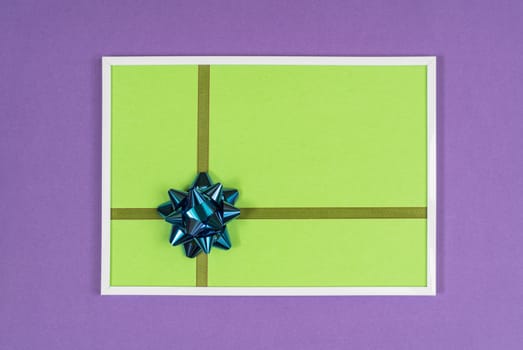 decorative bow in a white frame on a colored background