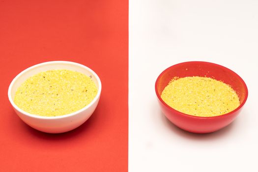 cornmeal the bowls on a colored background