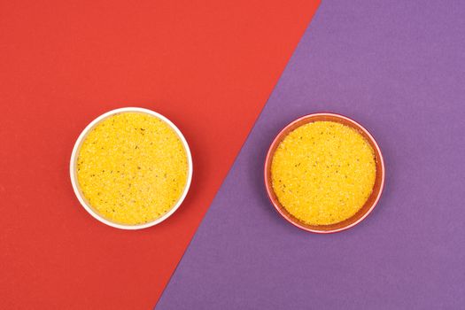 cornmeal a bowls on a colored background