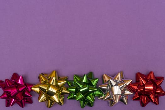 row of colored bows on a colored background