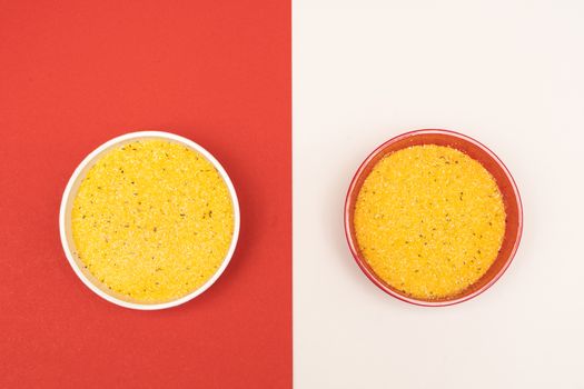 cornmeal a bowl on a colored background