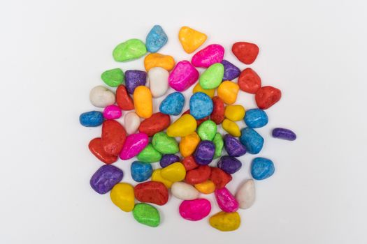 small colored pebbles on a colored background