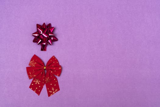 Christmas bows on a colored background