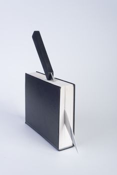 a black book cut with a knife