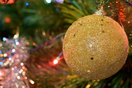 christmas balls on tree with lights and stars