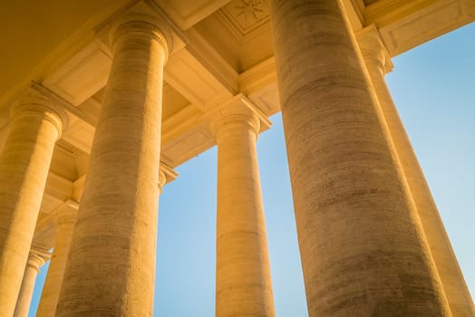 St Peter piazza columns in Rome at sunset