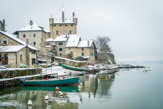 Yvoire village with snow in the winter in France
