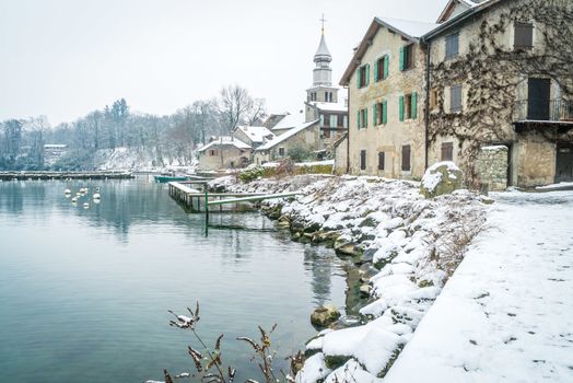 Yvoire village with snow in the winter in France