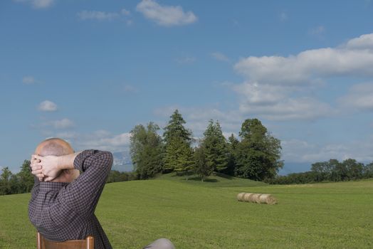 a man relaxed in front of a panorama