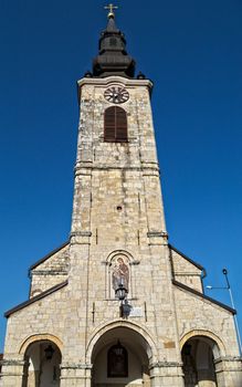 Clock tower on church in Sremska Kamenica, Serbia