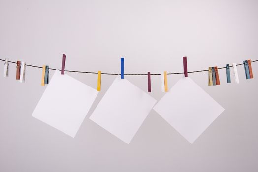 white paper sheets hanging