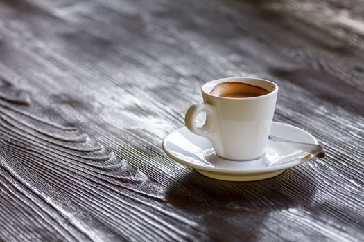 Invigorating morning cup of coffee on wooden table