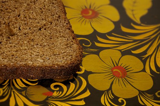 piece of rye bread on a cutting board, macro shot