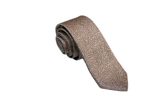 Closeup of an elegant stylish tie rolled and isolated on a white background.