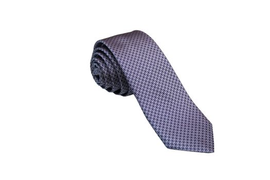 Closeup of an elegant stylish tie rolled and isolated on a white background.