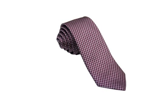 Closeup of an elegant stylish tie rolled and isolated on a white background.