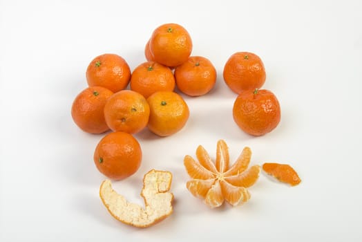 a peeled tangerine on a white table