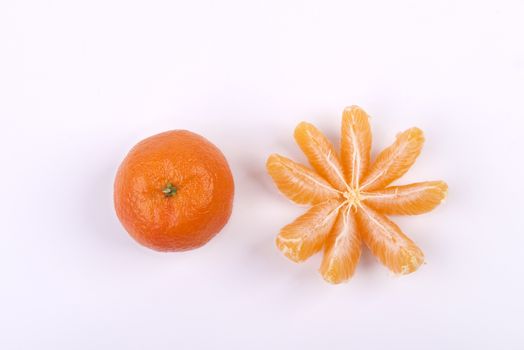 a peeled tangerine on a white table