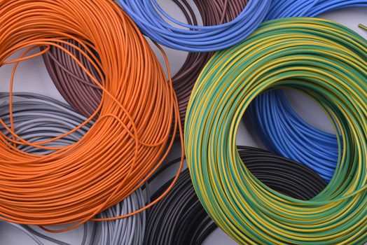 rolls of electric cable of various colors