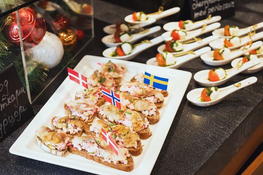 Trays with various delicious appetizer. Appetizer of fish.