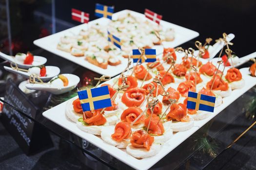 Trays with various delicious appetizer. Appetizer of fish.