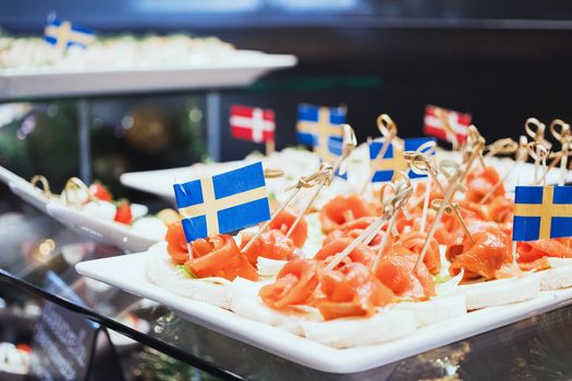 Trays with various delicious appetizer. Appetizer of fish.