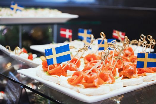 Trays with various delicious appetizer. Appetizer of fish.