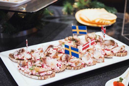 Trays with various delicious appetizer. Appetizer of fish.