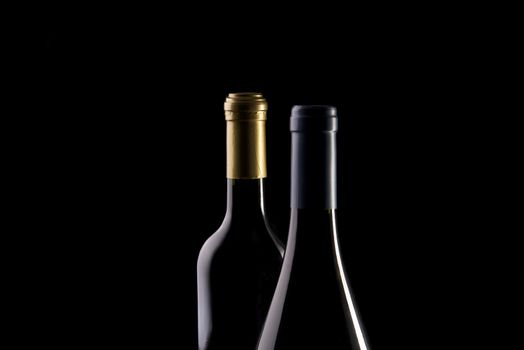 bottles of wine with a black background