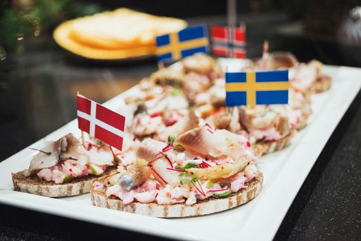 Trays with various delicious appetizer. Appetizer of fish.