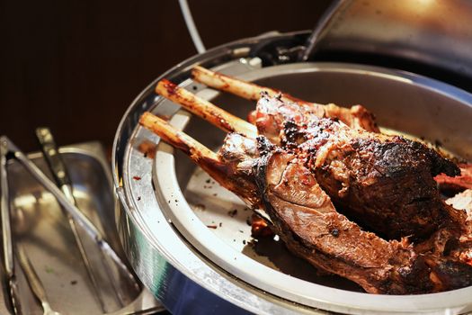 Beef steaks on the grill with flames.