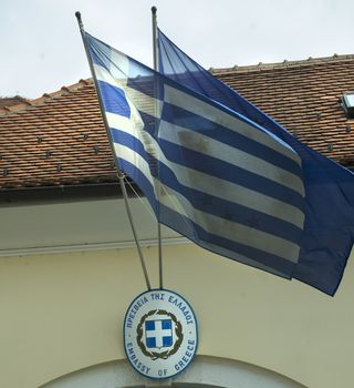 Greek and European flags in front of greek consulate in Pula, Croatia