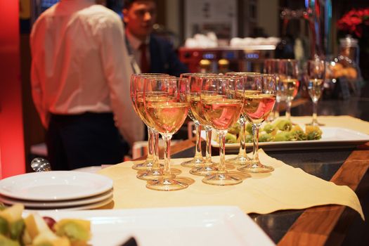 Bar counter with glasses and plates. Glasses on the bar.